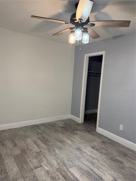 7409 Abonado Road, Unit 7409 Tampa, FL 33615 - Photo 9 of 25 a view of an empty room with wooden floor