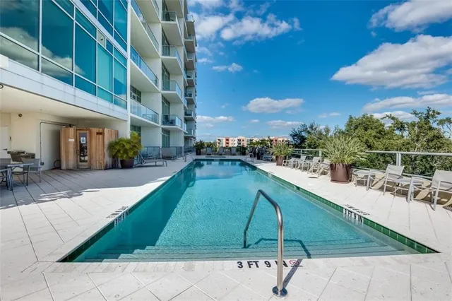 a view of a swimming pool with a lounge chairs