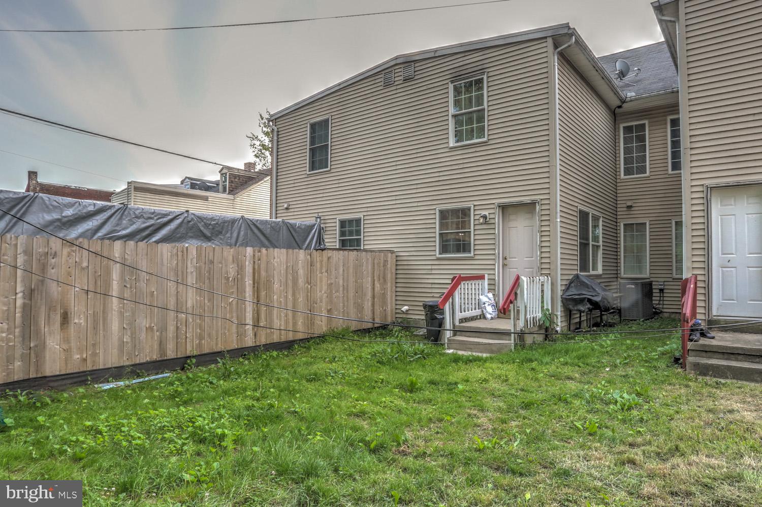 417 Green Street Lancaster, PA 17602 - Photo 9 of 37 a backyard of a house with table and chairs