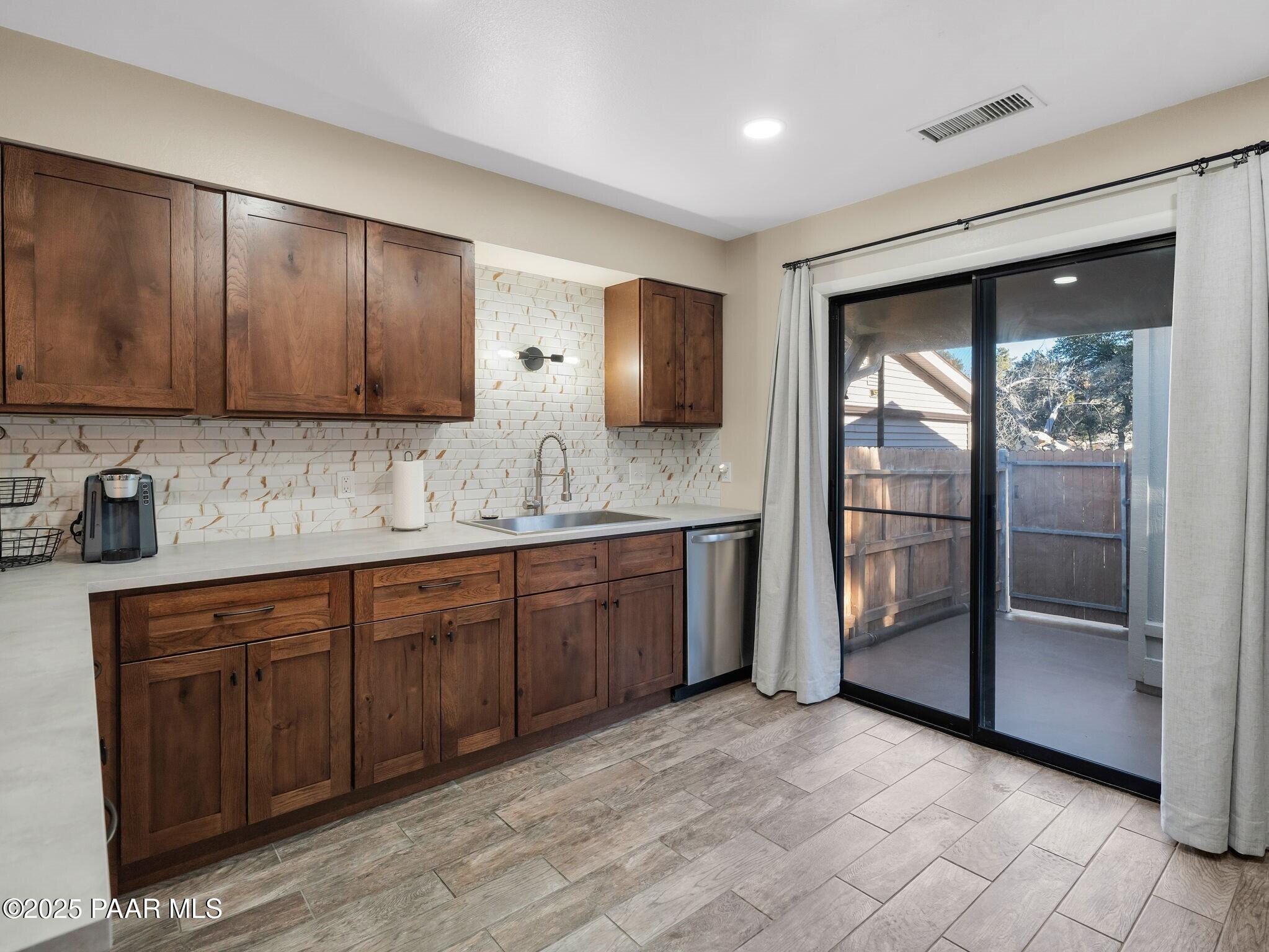 352 Rim Rock Circle, Unit 2 Prescott, AZ 86303 - Photo 11 of 25 a spacious bathroom with a granite countertop sink and a mirror