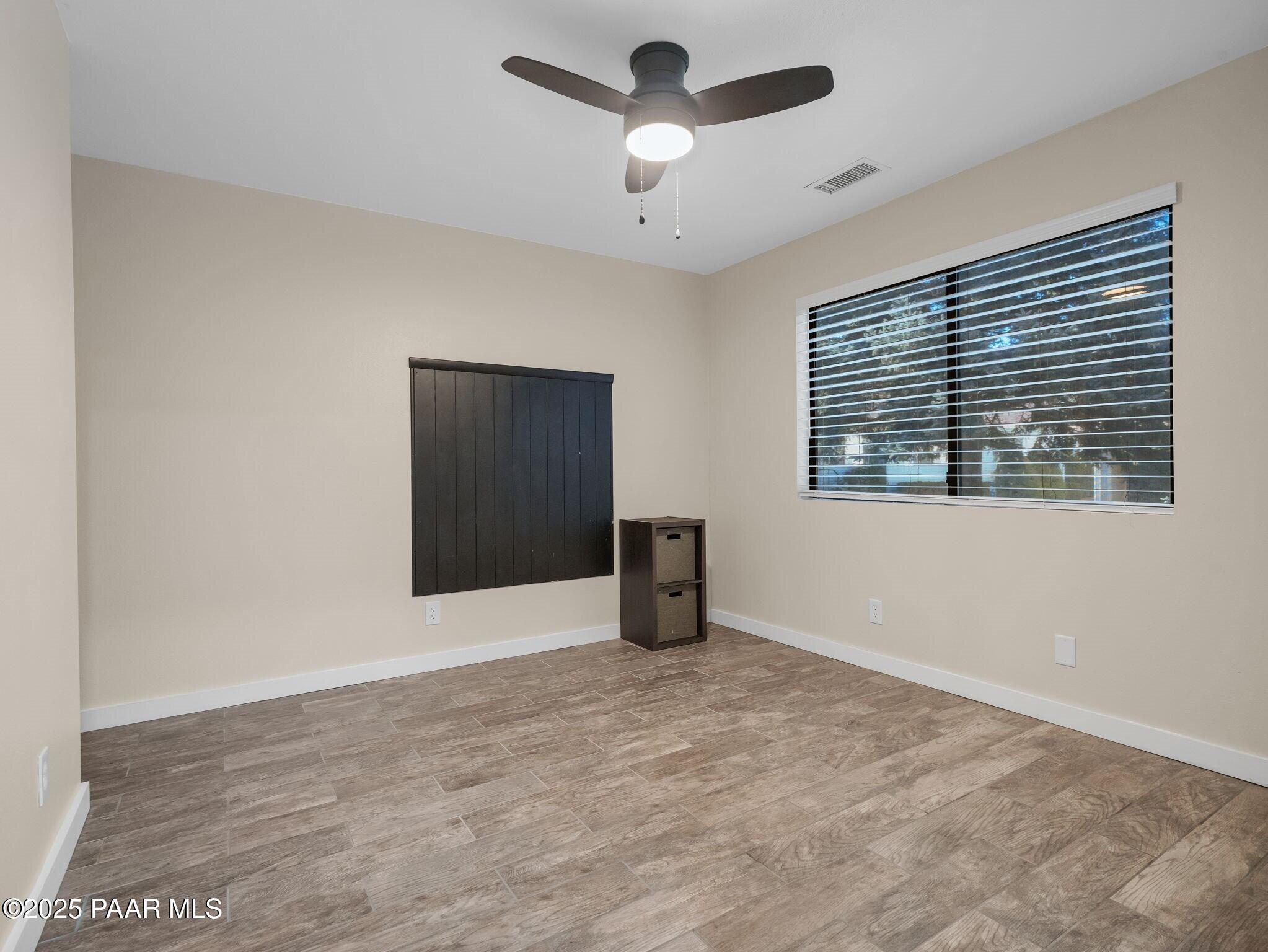 352 Rim Rock Circle, Unit 2 Prescott, AZ 86303 - Photo 14 of 25 a view of an empty room with a window
