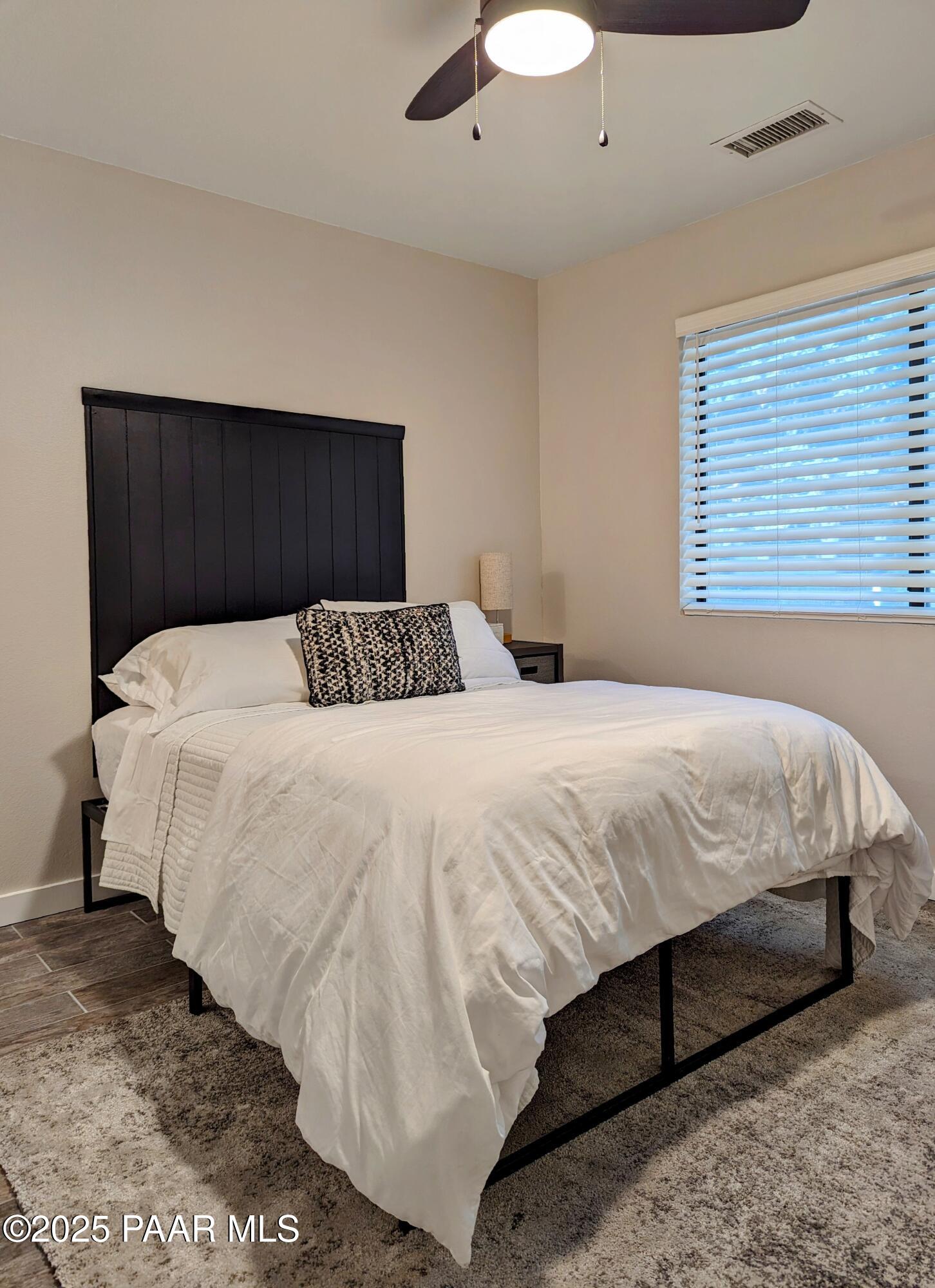 352 Rim Rock Circle, Unit 2 Prescott, AZ 86303 - Photo 15 of 25 a bedroom with a bed and a dresser
