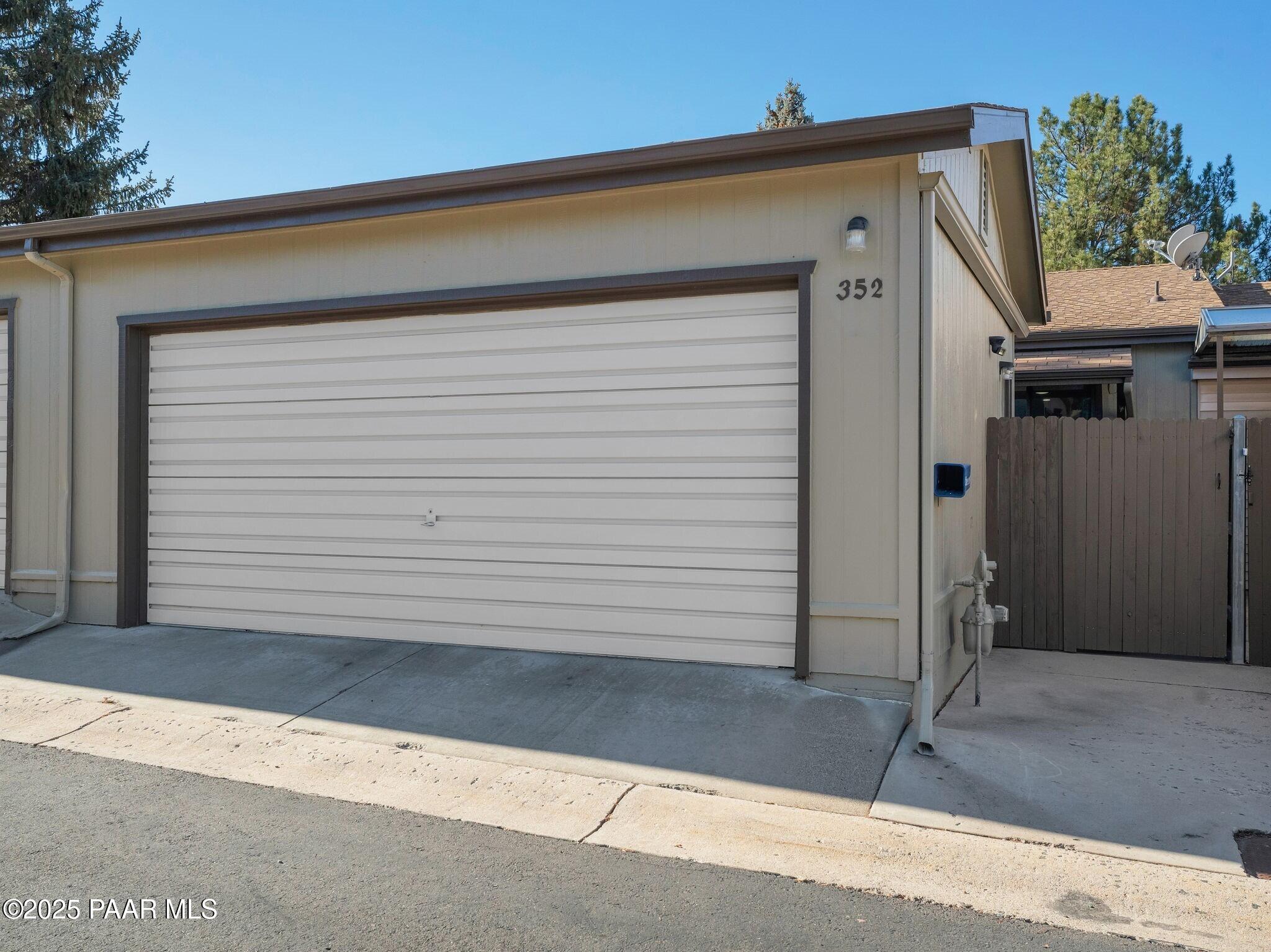 352 Rim Rock Circle, Unit 2 Prescott, AZ 86303 - Photo 3 of 25 a view of a house with a small garden