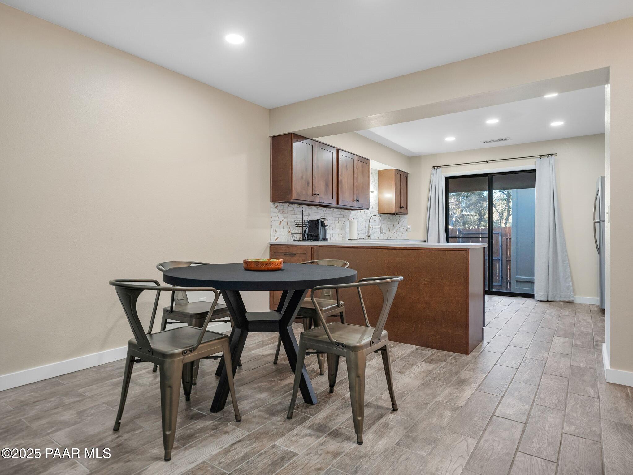 352 Rim Rock Circle, Unit 2 Prescott, AZ 86303 - Photo 8 of 25 a view of a dining room with furniture