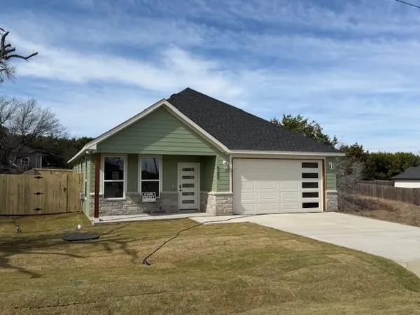 a front view of a house with a garage