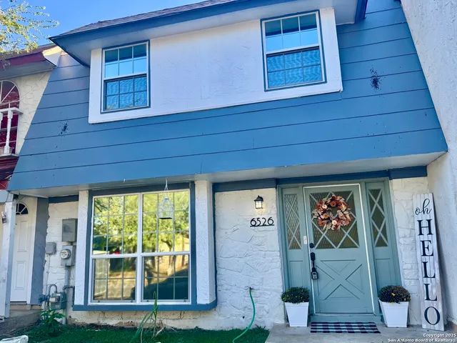 a front view of a house with a porch