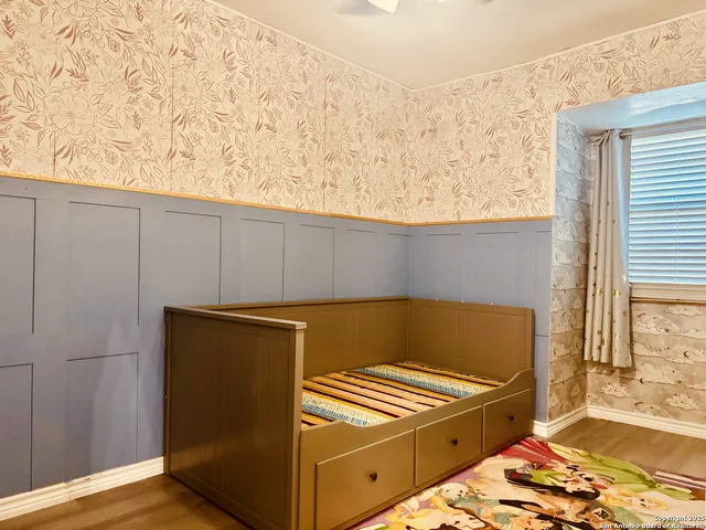 a view of a kitchen with wooden floor