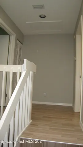 a view of wooden floor in hallway
