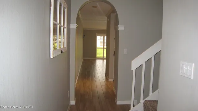 a view of a livingroom from a hallway