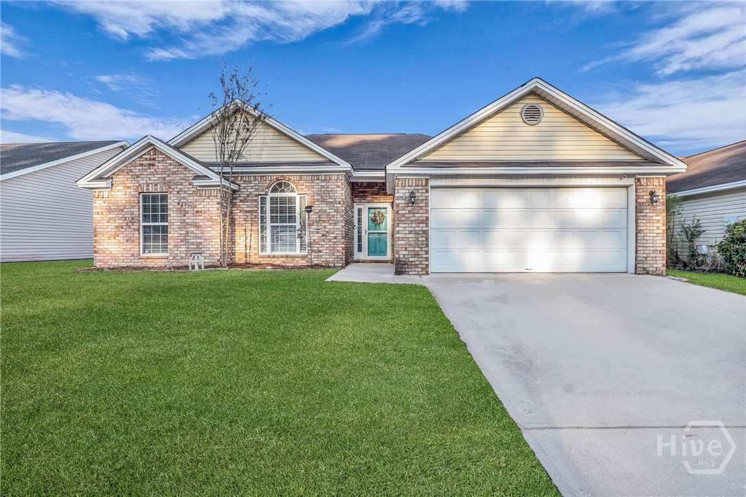 115 Aquinnah Drive Pooler, GA 31322 - Photo 1 of 35 Front of home *enhanced grass due to fall season*
