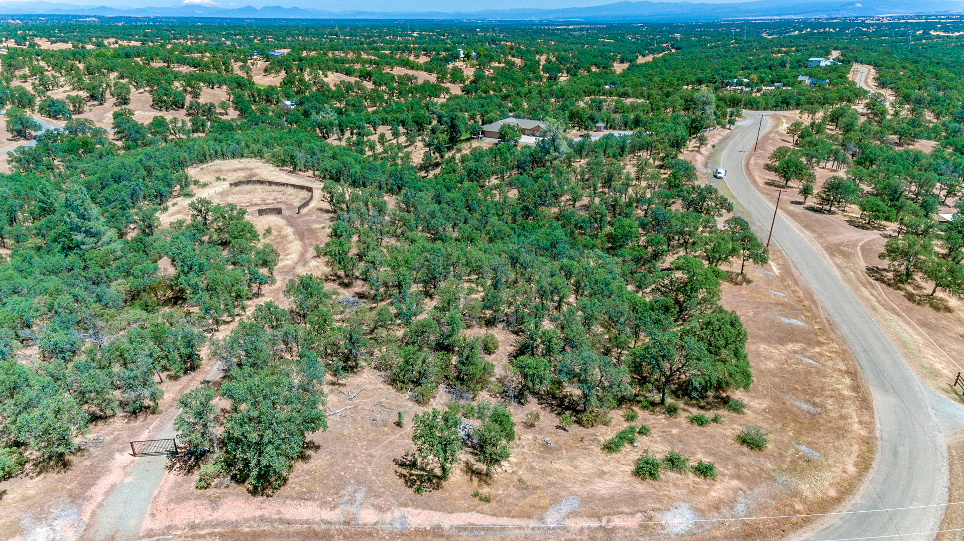 18180 Pack Saddle Road Cottonwood, CA 96022 - Photo 3 of 9 an aerial view of a house with a yard and lake view