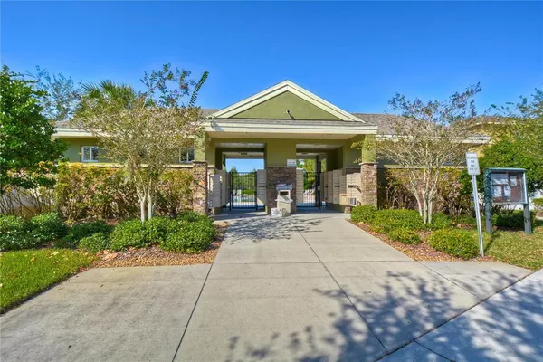 a view of a house with potted plants