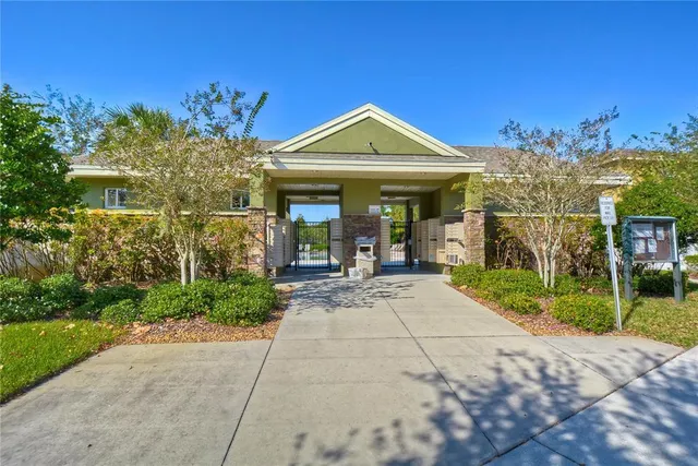 a view of a house with potted plants