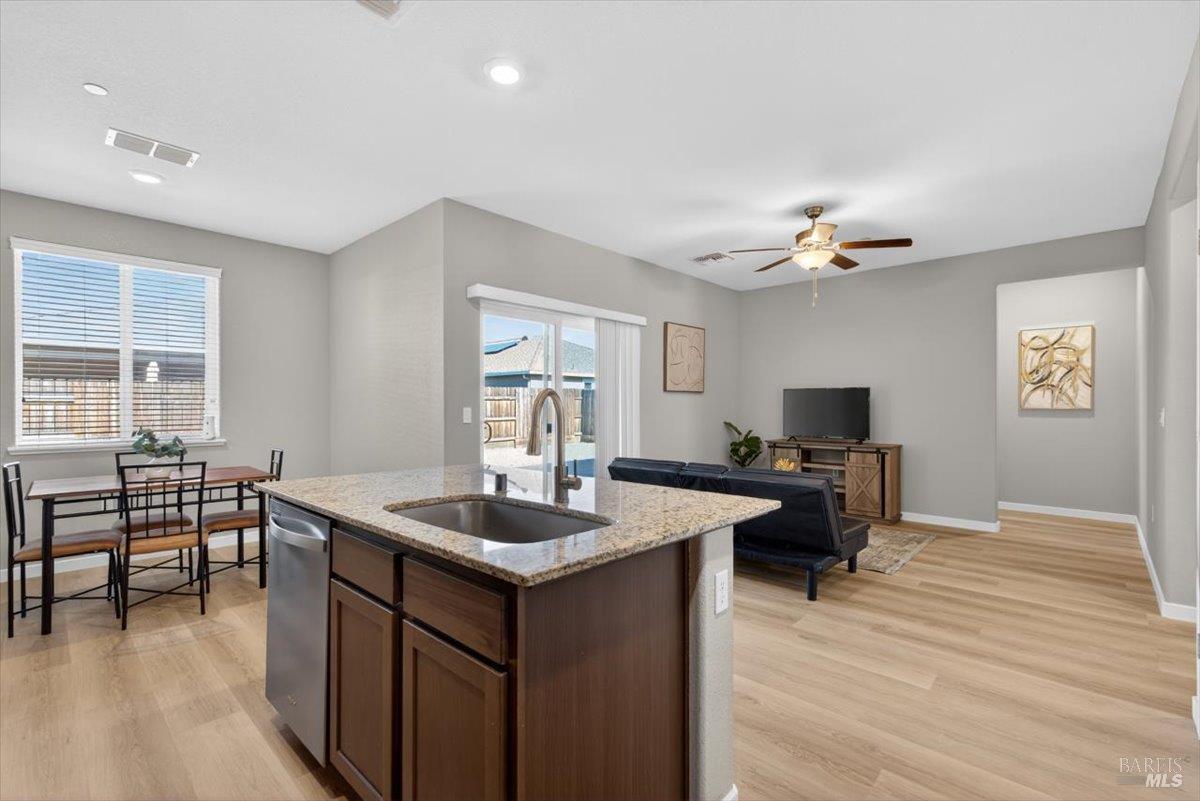 2275 Revival Lane Rio Vista, CA 94571 - Photo 7 of 31 a view of living room kitchen island stainless steel appliances wooden floor and living room view