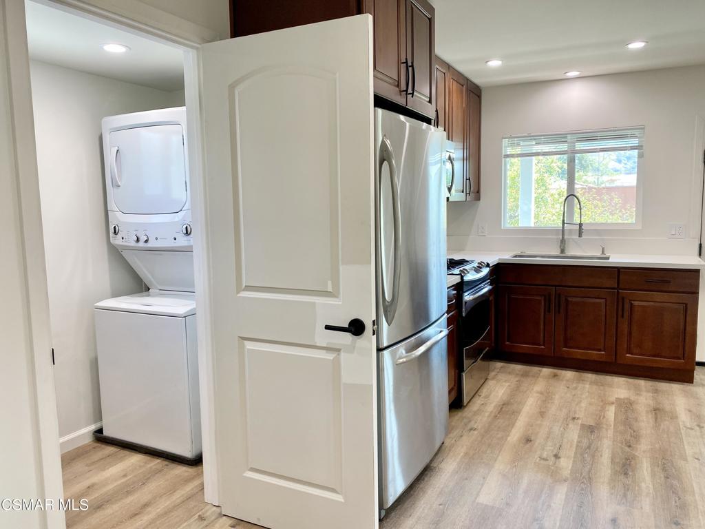 423 Saratoga Street, Unit B Fillmore, CA 93015 - Photo 11 of 20 a kitchen with stainless steel appliances a refrigerator and a sink