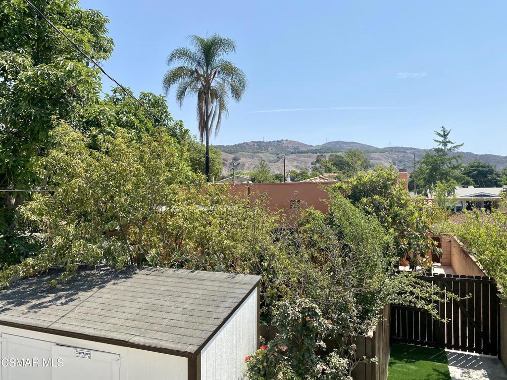423 Saratoga Street, Unit B Fillmore, CA 93015 - Photo 19 of 20 a view of a terrace with a garden and mountain view