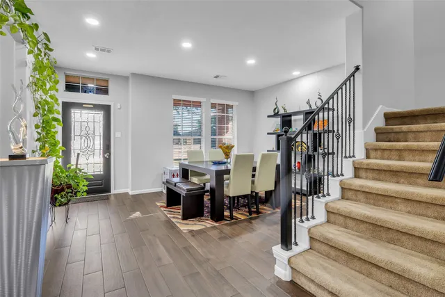 a view of entryway with livingroom and stairs