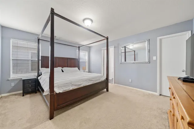 a bedroom with a bed and a cabinets
