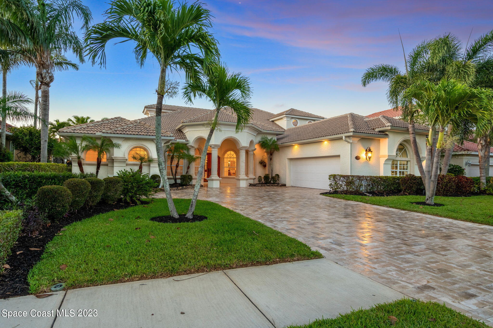 3308 Cappio Drive Melbourne, FL 32940 - Photo 1 of 42 a front view of a house with garden