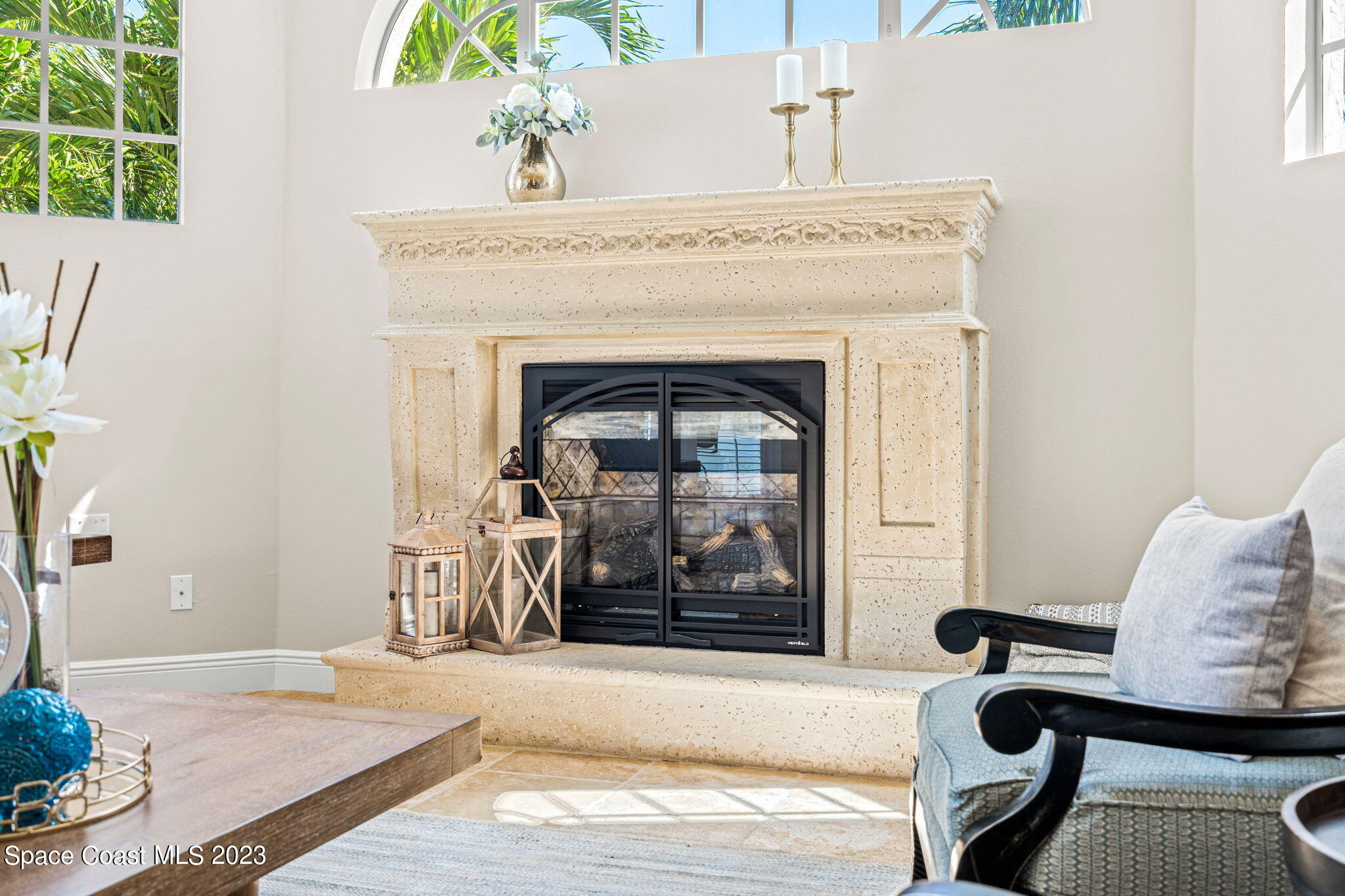 3308 Cappio Drive Melbourne, FL 32940 - Photo 12 of 42 a living room with furniture and a fireplace