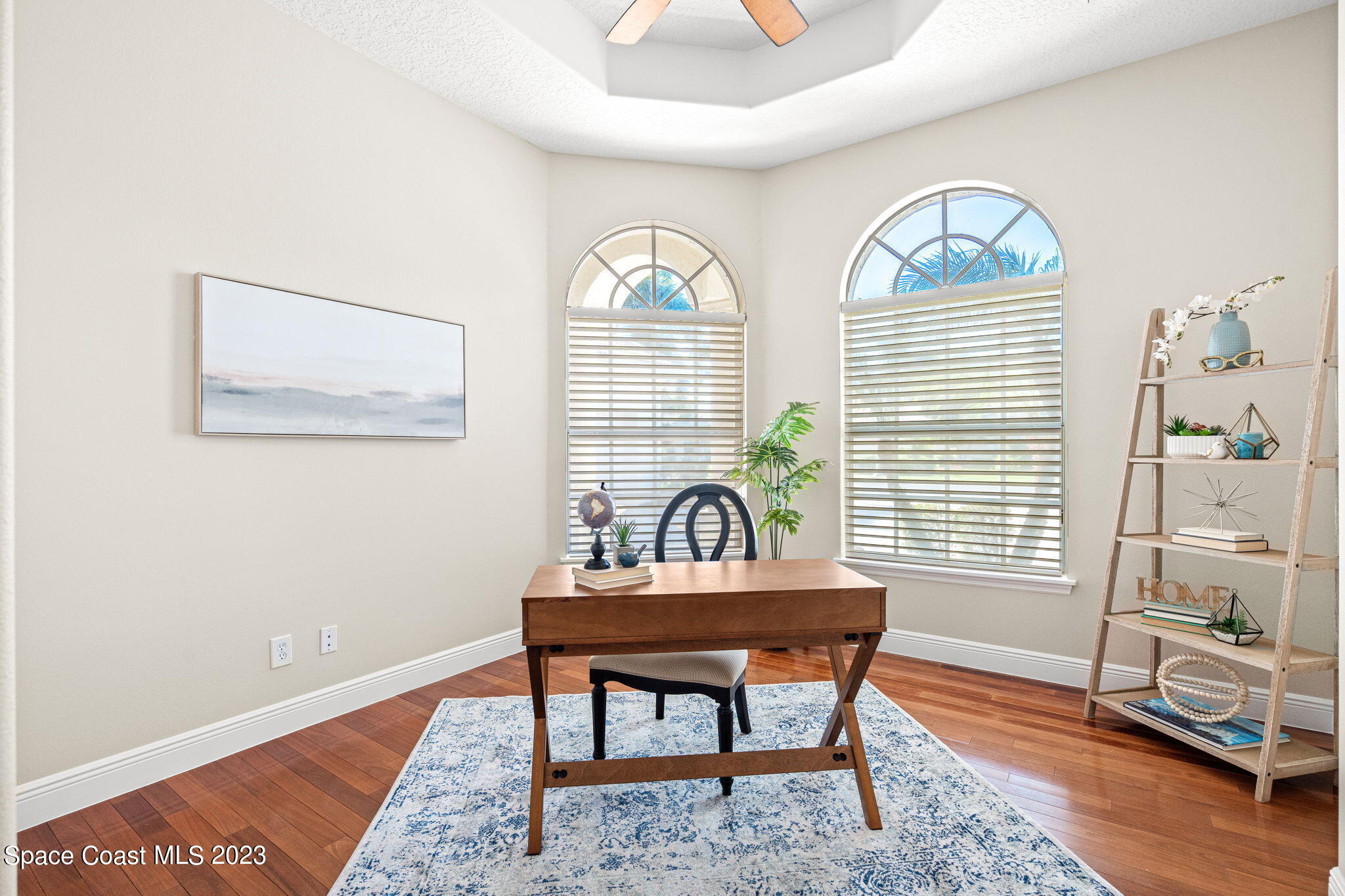 3308 Cappio Drive Melbourne, FL 32940 - Photo 17 of 42 a workspace with furniture and a window