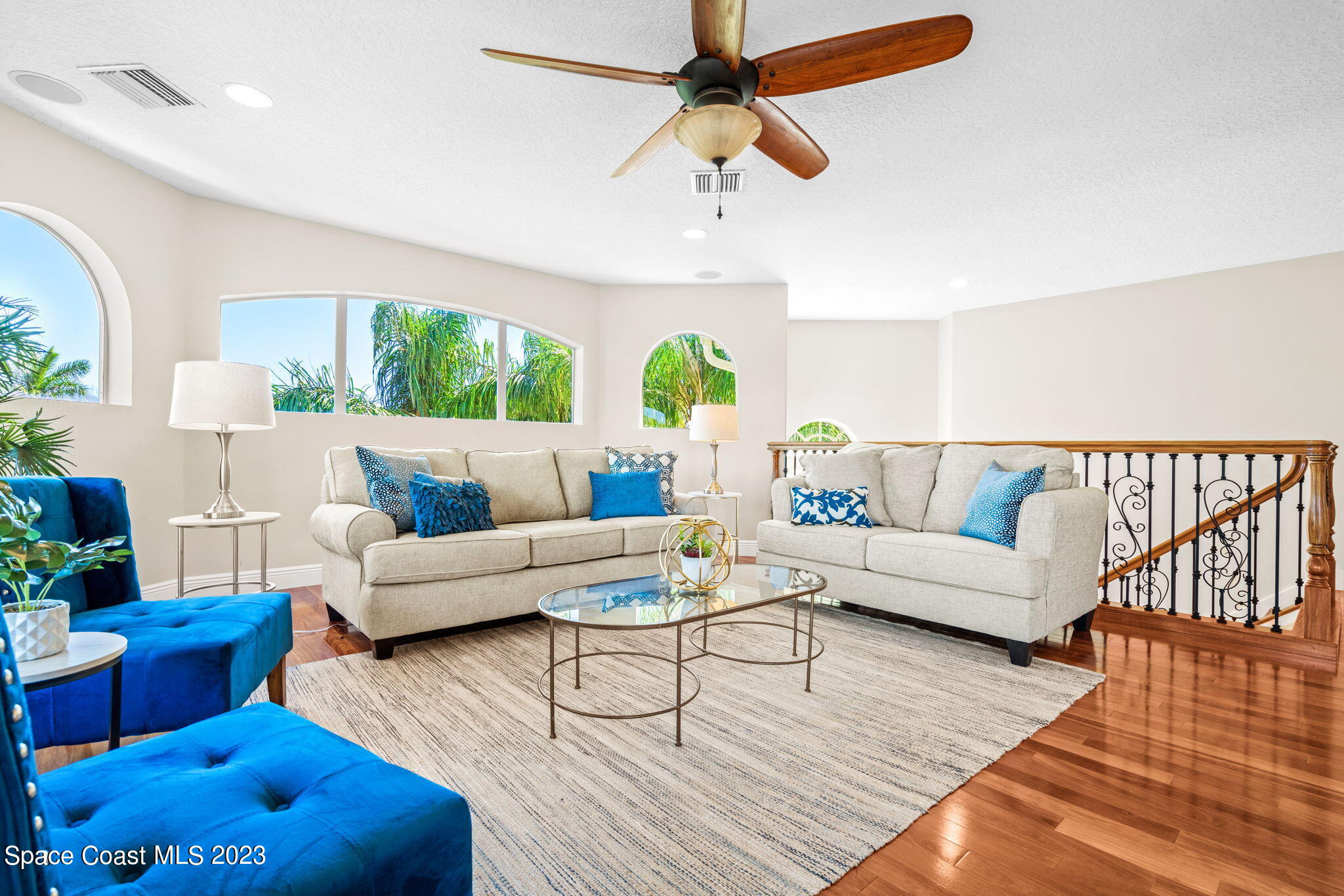 3308 Cappio Drive Melbourne, FL 32940 - Photo 20 of 42 a living room with furniture and a large window