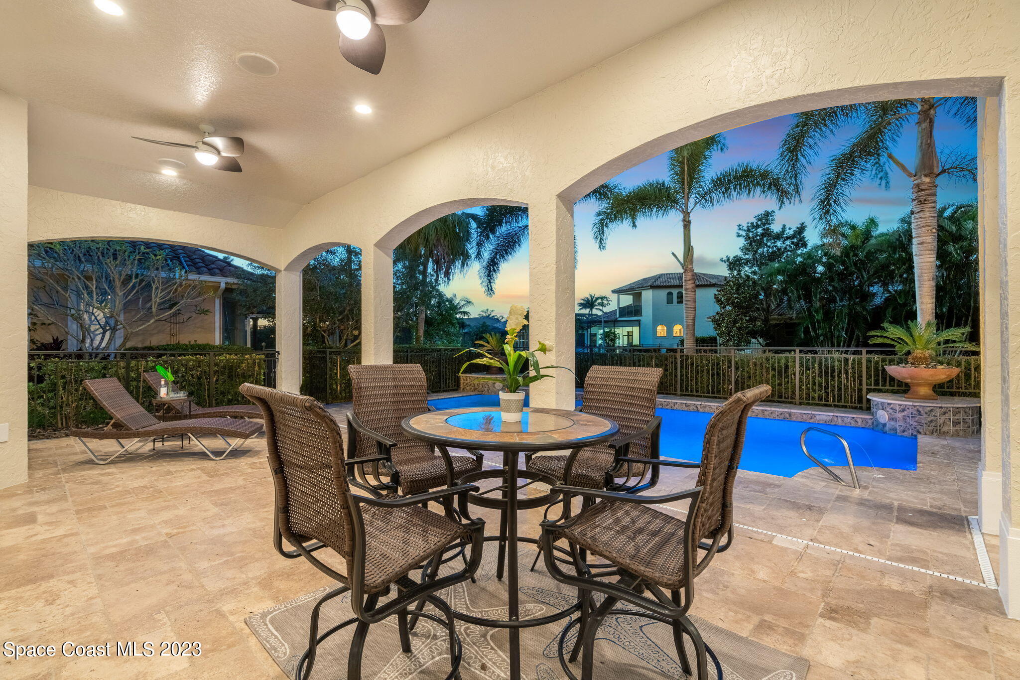 3308 Cappio Drive Melbourne, FL 32940 - Photo 30 of 42 a view of a dinning table and chairs in the patio