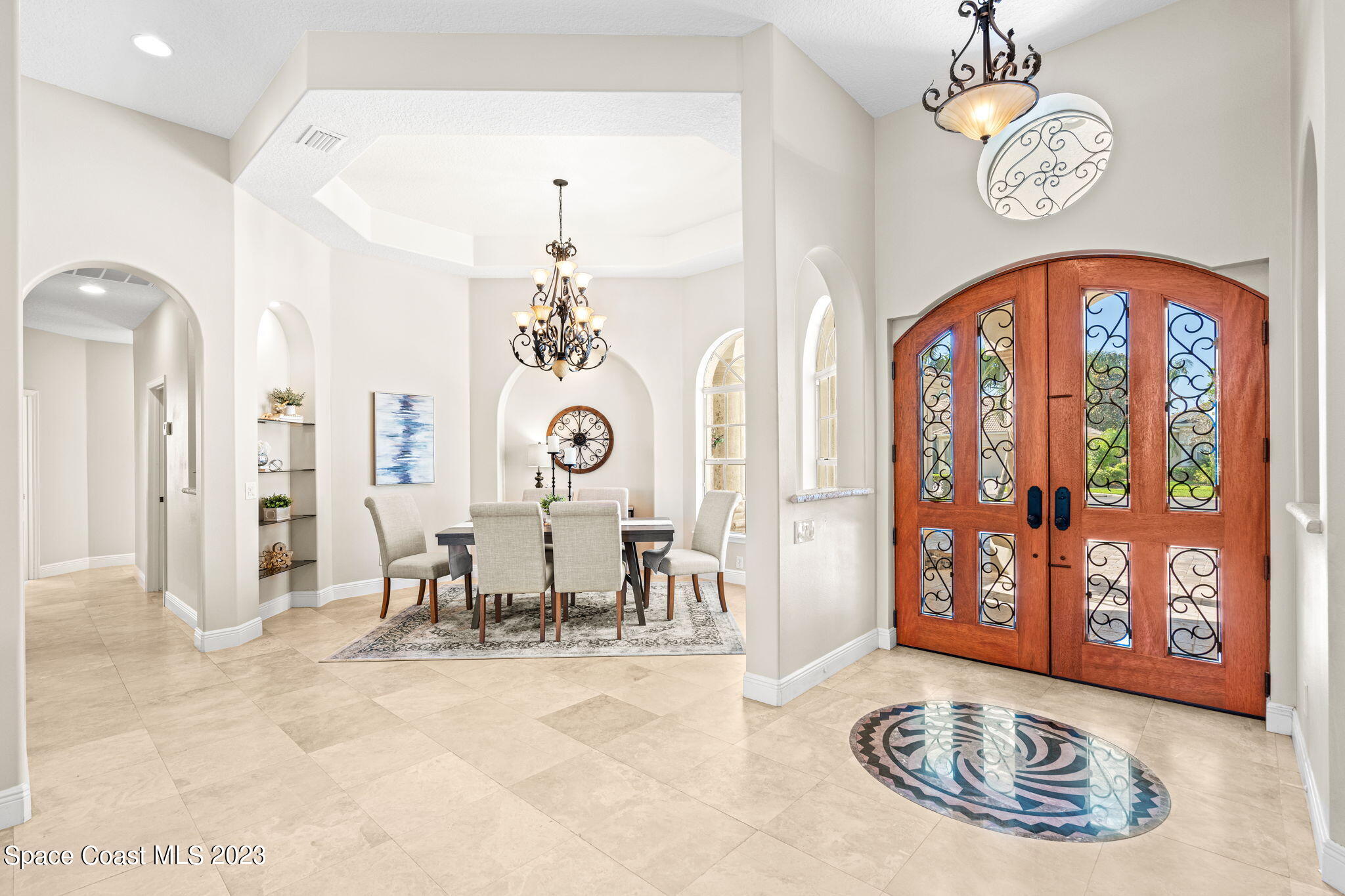 3308 Cappio Drive Melbourne, FL 32940 - Photo 3 of 42 a view of a room with furniture chandelier and windows