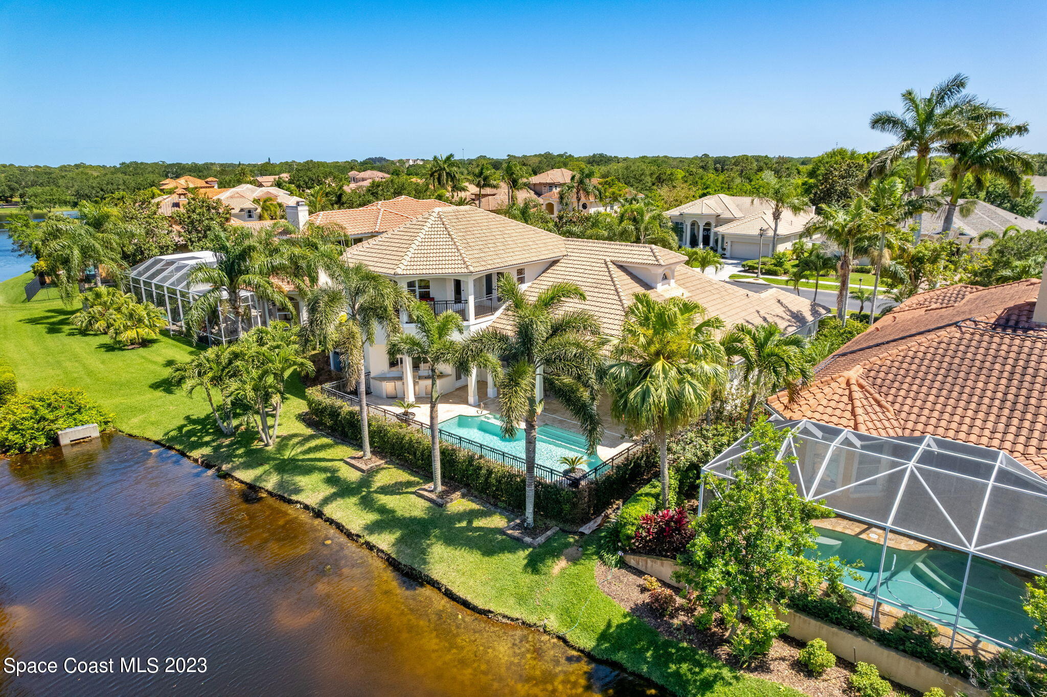 3308 Cappio Drive Melbourne, FL 32940 - Photo 37 of 42 a view of a lake with a garden