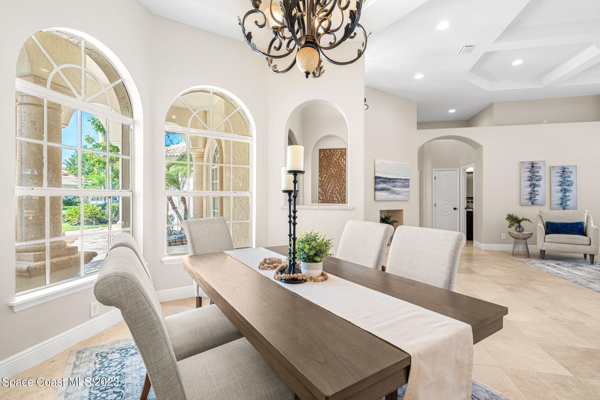 3308 Cappio Drive Melbourne, FL 32940 - Photo 4 of 42 a living room with furniture fireplace and large windows