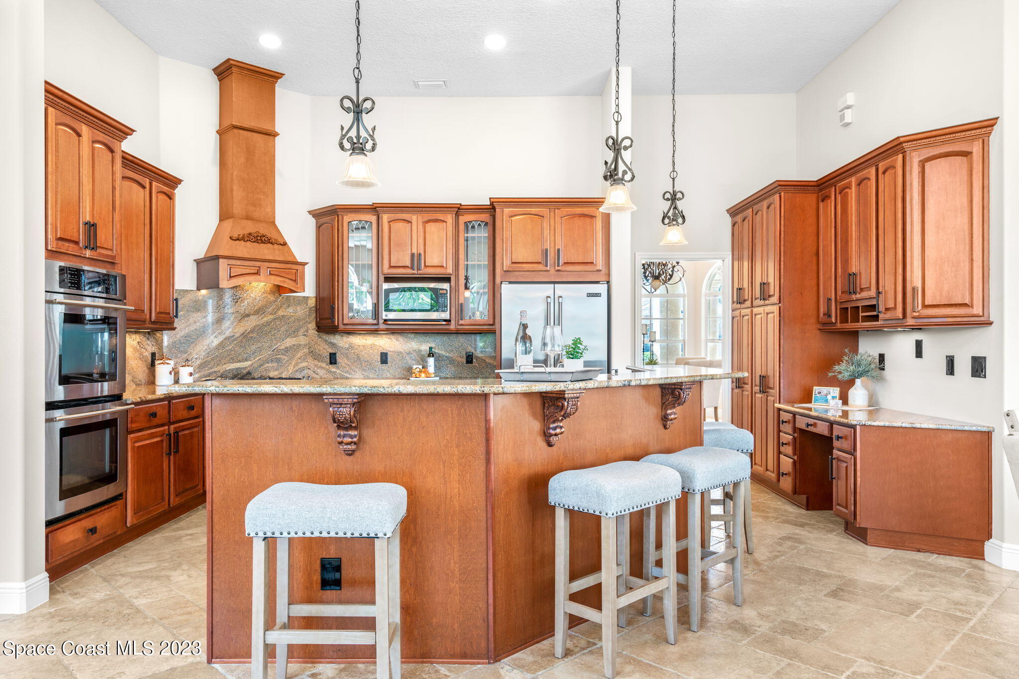 3308 Cappio Drive Melbourne, FL 32940 - Photo 9 of 42 a kitchen with stainless steel appliances a stove a refrigerator a sink dishwasher with a dining table and chairs
