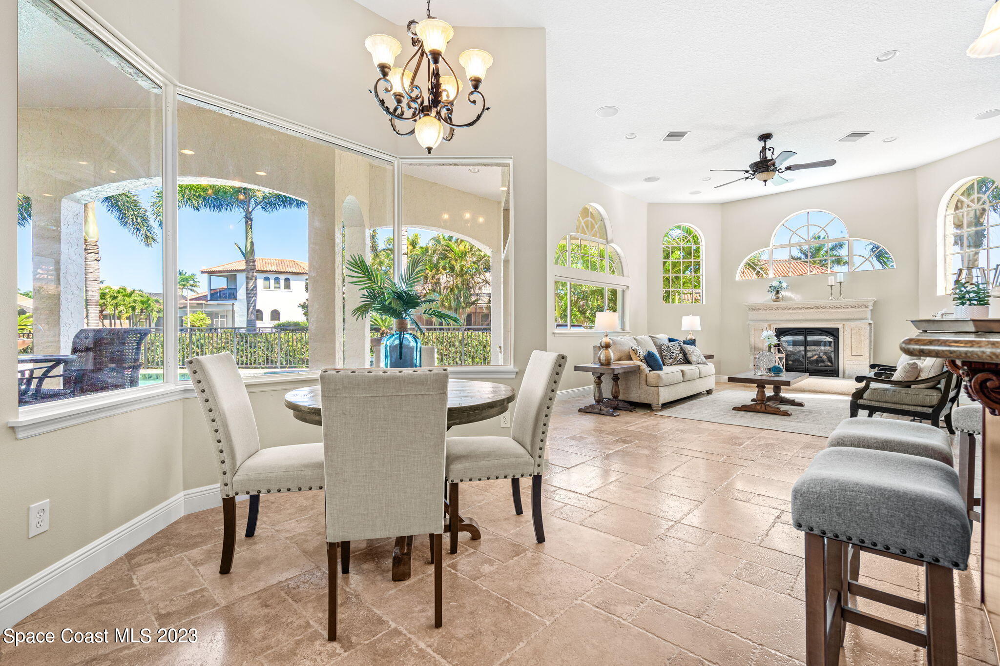 3308 Cappio Drive Melbourne, FL 32940 - Photo 10 of 42 a view of a dining room with furniture a chandelier and wooden floor