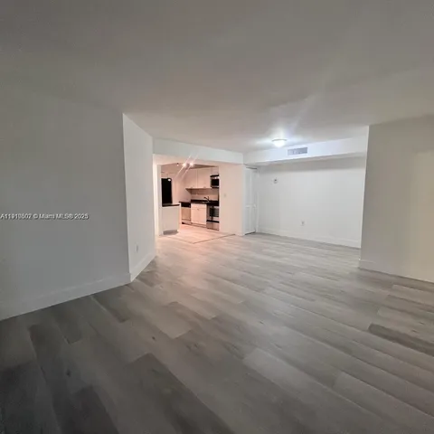 a view of a livingroom with wooden floor