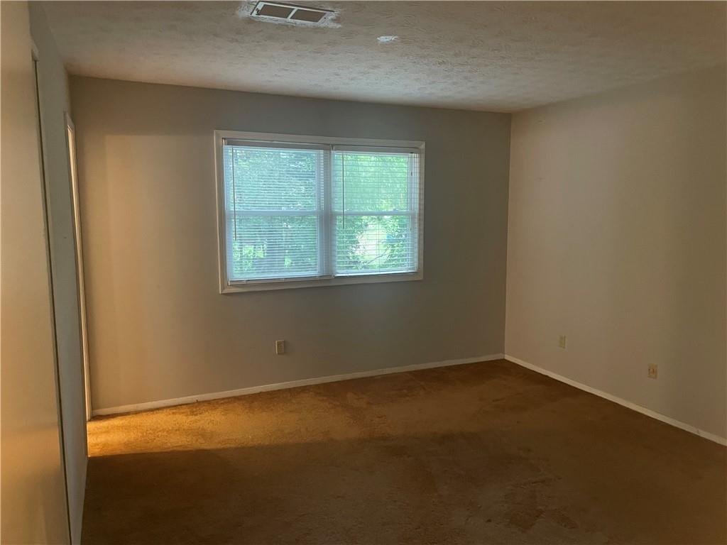 5341 Goodwick Way Northwest Norcross, GA 30071 - Photo 5 of 5 an empty room with a window