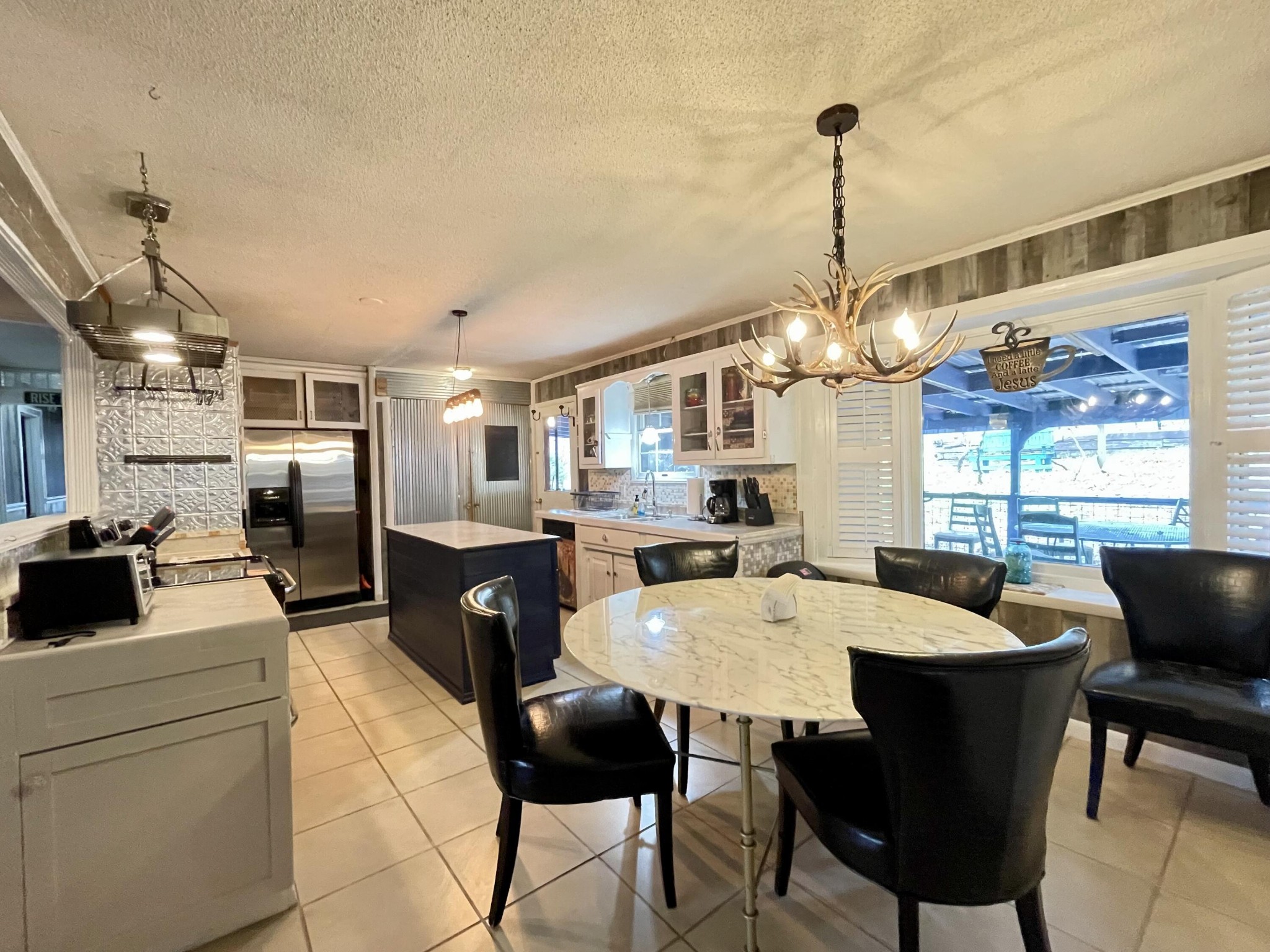 1522 Turkey Creek Road Tellico Plains, TN 37385 - Photo 18 of 34 a large kitchen with a table and chairs