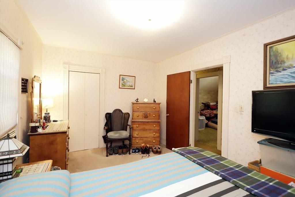 5 Anthony Street Acushnet, MA 02743 - Photo 24 of 37 a bedroom with furniture and a flat screen tv