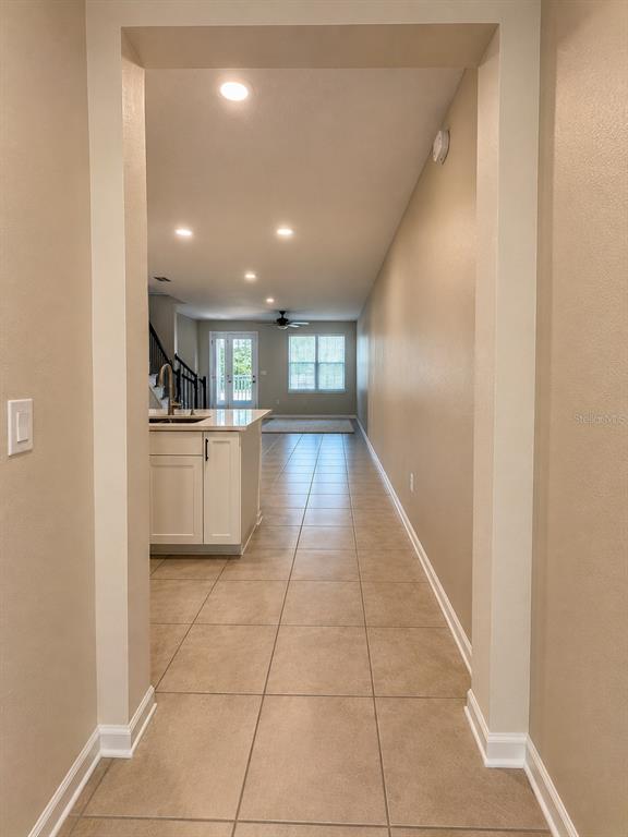 339 Redbud Road Palm Coast, FL 32137 - Photo 4 of 22 a open kitchen with a sink and cabinets