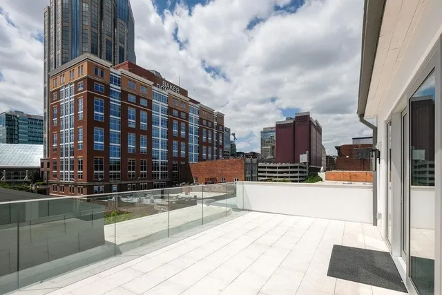 a bedroom with a bed and a mirror