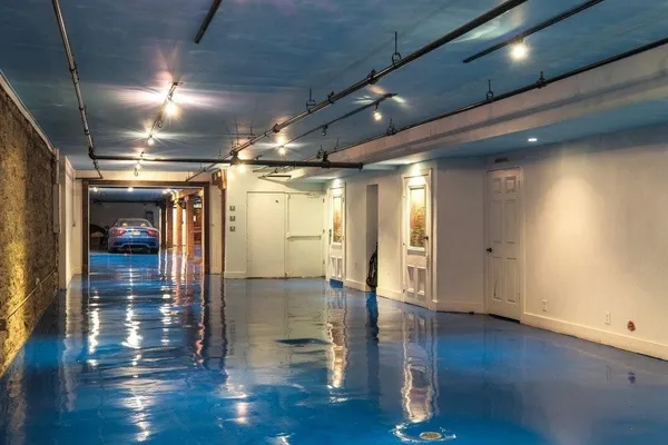 a view of tennis court with sitting area