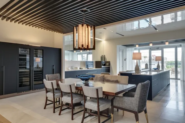 a dining room with furniture and window