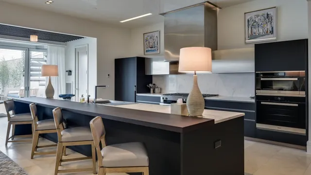 a kitchen with a sink cabinets and window
