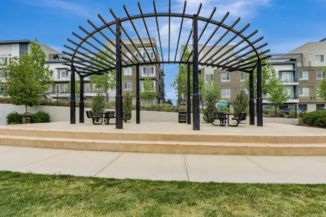 a view of a house with pool and sitting area