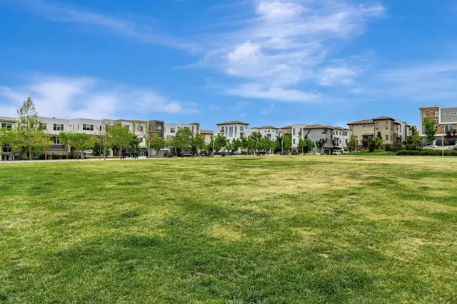 a view of a house with swimming pool and sitting area