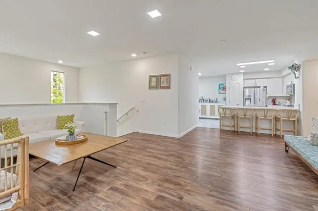 a view of a kitchen with dining table and chairs