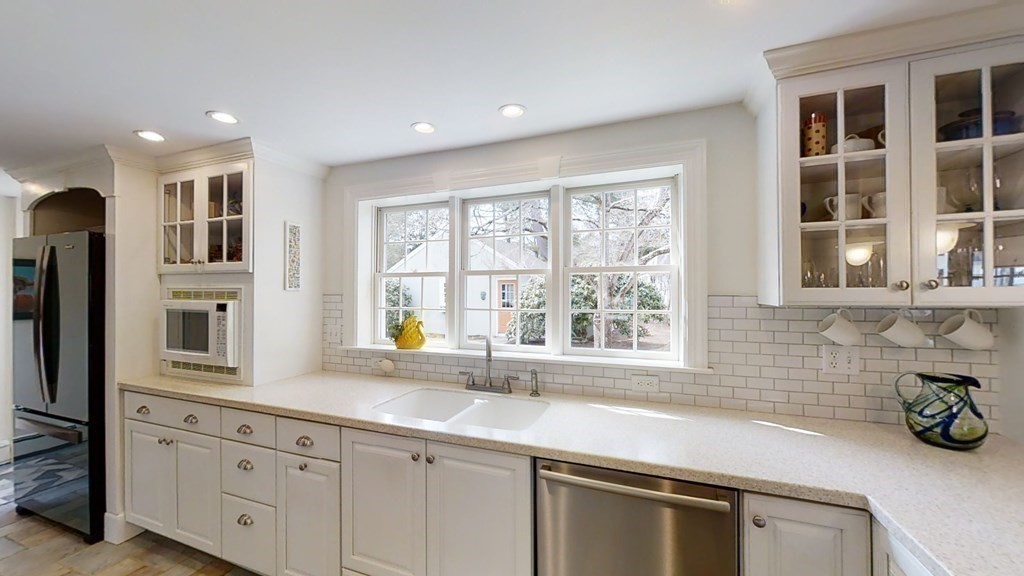 192 Berwick Road Attleboro, MA 02703 - Photo 15 of 42 a kitchen with stainless steel appliances a sink a stove and a window