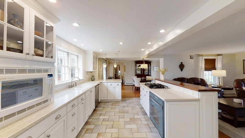 192 Berwick Road Attleboro, MA 02703 - Photo 17 of 42 a kitchen that has a lot of cabinets in it