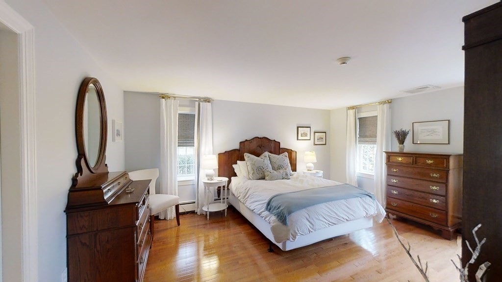 192 Berwick Road Attleboro, MA 02703 - Photo 18 of 42 a bedroom with a bed a mirror and dresser