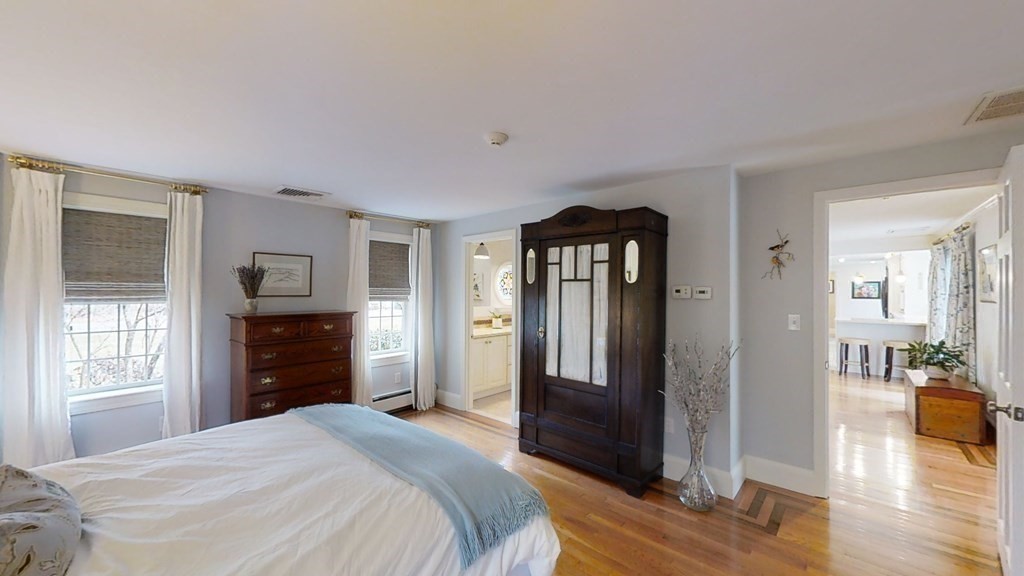 192 Berwick Road Attleboro, MA 02703 - Photo 20 of 42 a bedroom with a bed and wooden floor