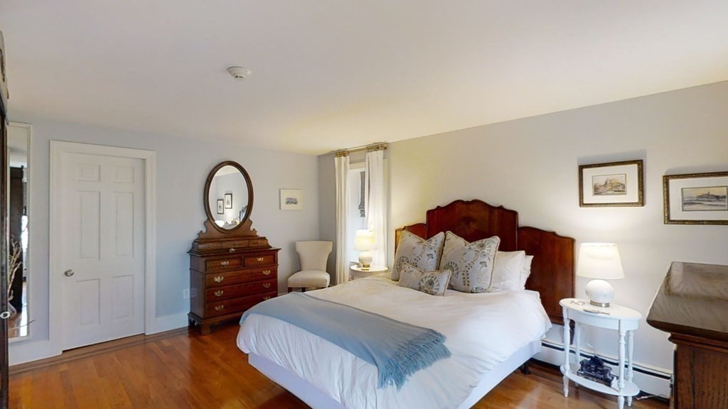 192 Berwick Road Attleboro, MA 02703 - Photo 21 of 42 a bedroom with a bed and a chandelier