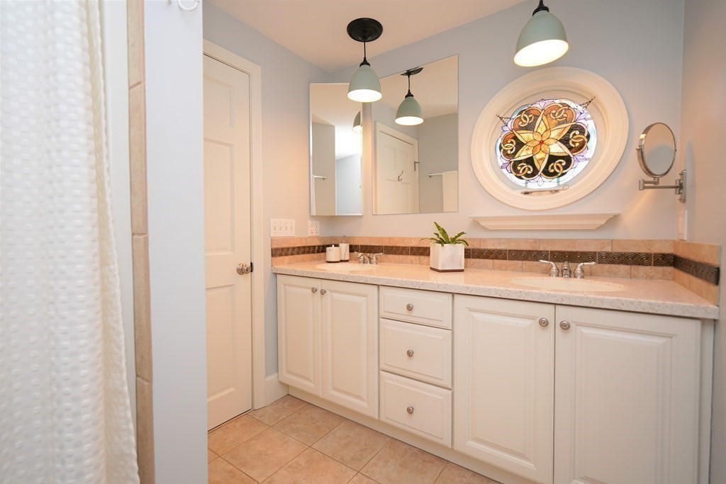 192 Berwick Road Attleboro, MA 02703 - Photo 22 of 42 a bathroom with a sink and a mirror